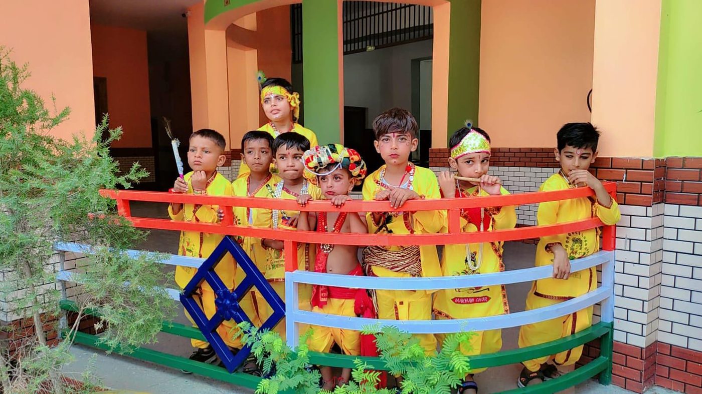 Students dressed as Krishna for the school's Janmashtami celebration