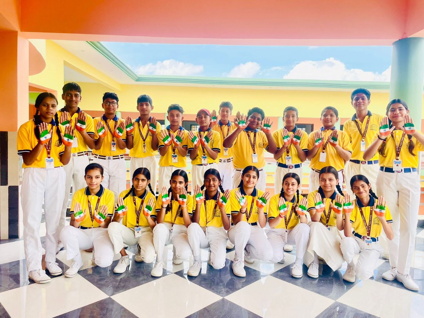 Students showing tricolour hand paint for Independence Day