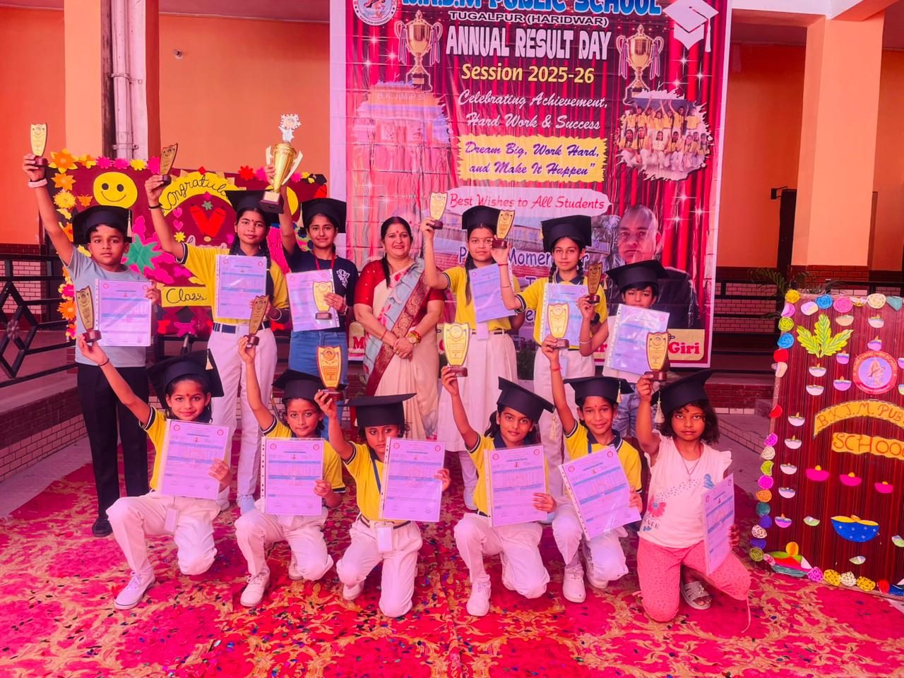 Students celebrating with their awards on Result Day
