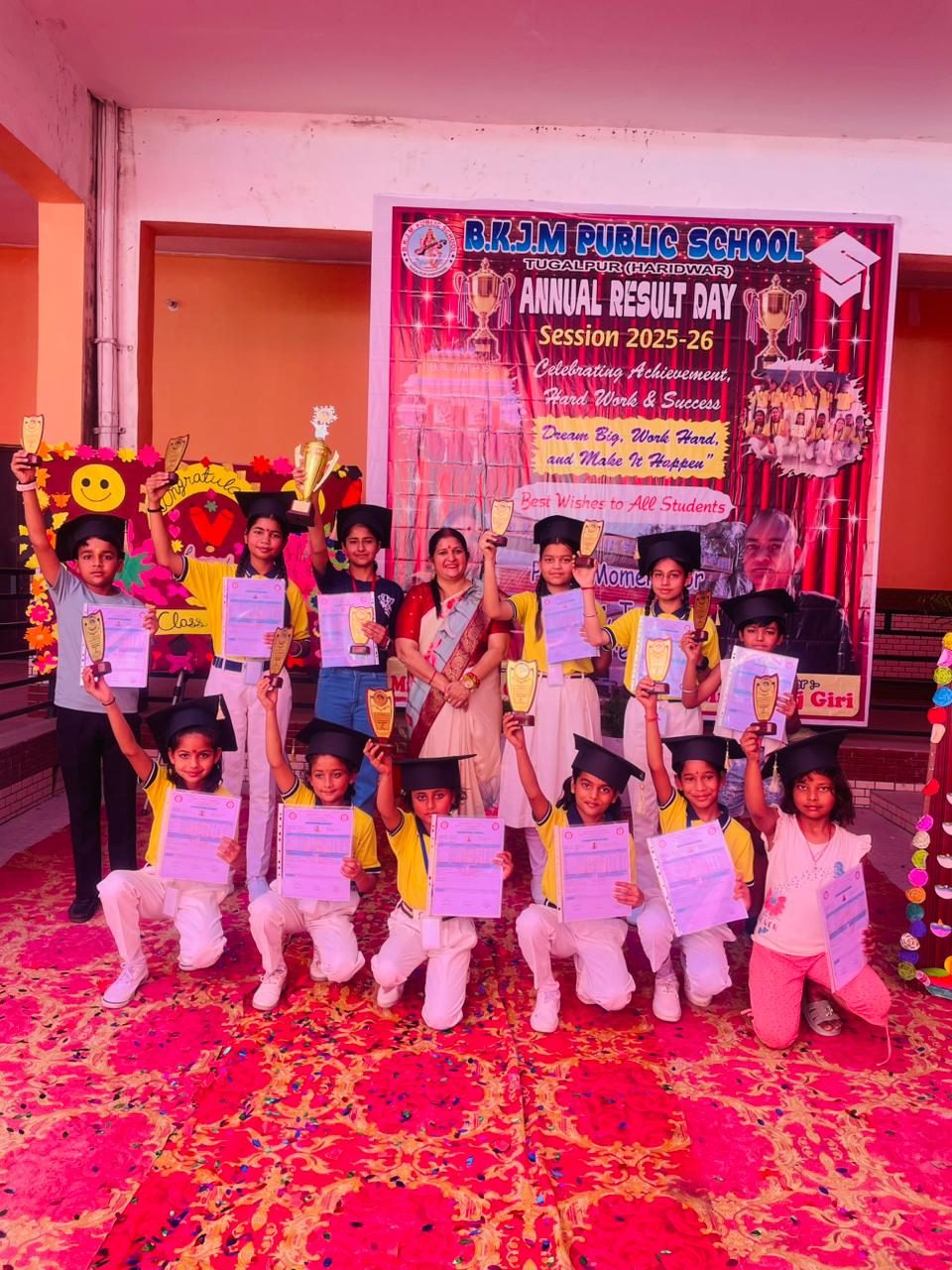 Students posing with their trophies and certificates
