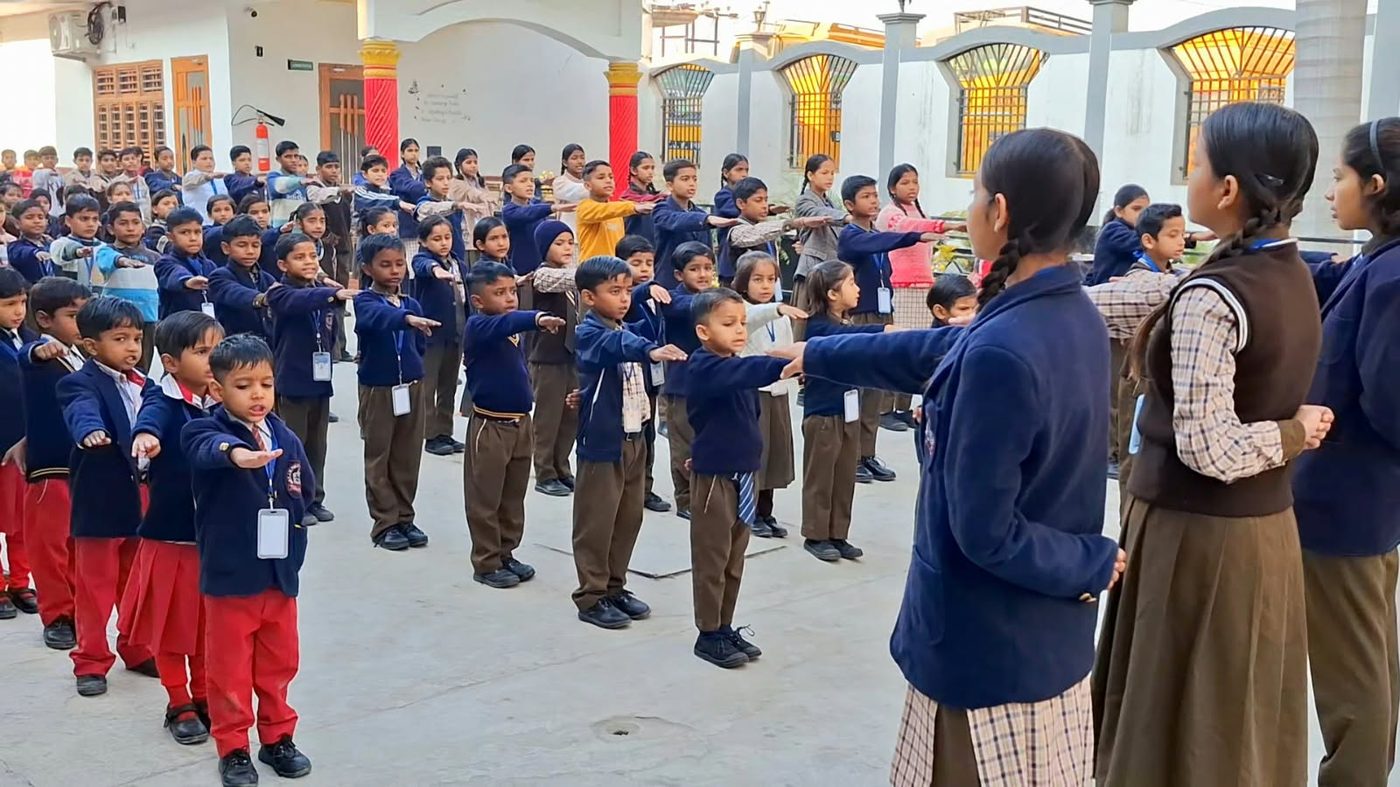 Students doing PT exercises in assembly